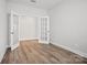 Hardwood floor flex room with double French doors and natural light at 1726 Riverbend Ave # 177, Belmont, NC 28012