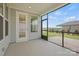 An open screened porch has a view of the yard and home with muted blue vinyl siding at 1726 Riverbend Ave # 177, Belmont, NC 28012