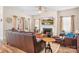 Inviting living room features a fireplace, ceiling fan, and comfortable leather seating at 1903 Lotus Ln, Denver, NC 28037