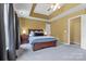 This beautiful main bedroom features a decorative trey ceiling and a large window with natural light at 203 Chandeleur Dr, Mooresville, NC 28117