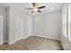 Spacious bedroom with hardwood floors, ceiling fan, and neutral wall colors at 228 Chestnut St # 66, Shelby, NC 28150