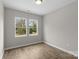 Well lit bedroom with beautiful flooring and two bright windows at 228 Chestnut St # 66, Shelby, NC 28150