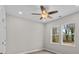 Bright bedroom with a ceiling fan and two windows offering natural light at 228 Chestnut St # 66, Shelby, NC 28150