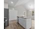 Modern kitchen featuring an island with granite counters, a stainless steel dishwasher, and white cabinetry at 228 Chestnut St # 66, Shelby, NC 28150