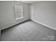 Bedroom featuring neutral walls, plush carpet, and natural light at 4017 Linville Falls Ln, Monroe, NC 28110