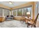 Sunroom with tile floors and lots of natural light from the many surrounding windows at 4096 Fairview Dr, Maiden, NC 28650