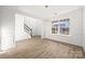 Elegant dining room with hardwood floors, wainscoting, and contemporary lighting, and natural light at 4630 Hannah Dr, Rock Hill, SC 29732