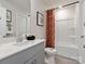 Clean bathroom featuring a white vanity, framed mirror, and combined tub and shower at 5006 Kellaher Pl, Charlotte, NC 28216