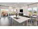 Bright open floor plan featuring a large kitchen island and living room with lots of natural light at 5006 Kellaher Pl, Charlotte, NC 28216