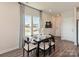 Bright dining area with modern lighting and a view of the outdoors at 5030 Kellaher Pl, Charlotte, NC 28216