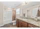 Full bathroom with granite countertop vanity and shower with tub combination at 610 John St, Monroe, NC 28110