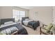 Well-lit bedroom features two twin beds and a large window at 610 John St, Monroe, NC 28110