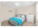Comfortable bedroom with light blue bedding and a white dresser at 610 John St, Monroe, NC 28110