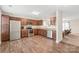 Modern kitchen boasts stainless steel appliances and sleek wooden flooring at 610 John St, Monroe, NC 28110