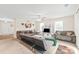 Spacious living room with large windows, neutral walls, and comfortable seating, perfect for relaxation and entertaining at 610 John St, Monroe, NC 28110