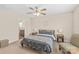 Comfortable bedroom with a ceiling fan, carpet, and access to an ensuite bathroom at 610 John St, Monroe, NC 28110