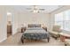 Serene bedroom features a decorative headboard, accent chair, and carpet at 610 John St, Monroe, NC 28110