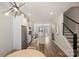 Open kitchen with a center island, stainless steel appliances, and a view leading into the adjacent living area and staircase at 619 W Tremont Ave, Charlotte, NC 28203