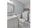 Bathroom with a white vanity, tile floors, and modern laundry appliances at 708 S 10Th St, Bessemer City, NC 28016