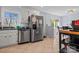 Kitchen featuring stainless steel appliances, neutral color cabinetry, and a tiled floor at 7209 Kilcullen Dr, Charlotte, NC 28270