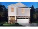 Charming two-story home featuring stone accents, white trim, and an attached two-car garage at 837 Blue Canyon Dr, York, SC 29745