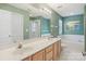 A spacious bathroom with dual sinks, a soaking tub, and a separate shower at 10422 Baskerville Ave, Charlotte, NC 28269