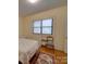 Cozy bedroom with hardwood floors and a window letting in plenty of natural light at 1124 Evergreen Cir, Rock Hill, SC 29732