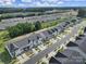 An aerial view of a well-planned neighborhood streetscape with colorful homes and mature trees at 116 Briana Marie Way, Indian Trail, NC 28079