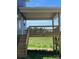 Features a covered deck with stairs leading to a grassy yard; ideal for outdoor living and entertaining at 1459 Mocksville Hwy # 19, Statesville, NC 28625
