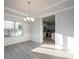 Bright dining area with natural light from large windows is adjacent to the kitchen at 1459 Mocksville Hwy # 19, Statesville, NC 28625