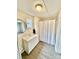 Bathroom featuring a vanity, round mirror, and shower-tub combination at 1718 Fallston Rd, Shelby, NC 28150