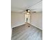 This bedroom has hardwood floors, a ceiling fan, and natural light at 1718 Fallston Rd, Shelby, NC 28150
