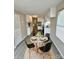 Dining area features a modern table set, new flooring, and neutral-colored walls at 1718 Fallston Rd, Shelby, NC 28150