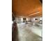 Empty garage featuring concrete floors, exposed ceiling, and multiple windows at 1718 Fallston Rd, Shelby, NC 28150