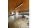 Empty garage featuring concrete floors, exposed ceiling, and multiple windows at 1718 Fallston Rd, Shelby, NC 28150