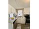 Updated kitchen boasts white cabinetry, stainless steel appliances, and gray countertops at 1718 Fallston Rd, Shelby, NC 28150