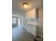 Kitchen featuring updated cabinets, a neutral color palette, and new gray flooring at 1718 Fallston Rd, Shelby, NC 28150