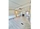 Bright living room featuring neutral walls, a ceiling fan, fireplace, and an open layout flowing into other spaces at 1718 Fallston Rd, Shelby, NC 28150