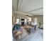 Open-concept living room featuring a modern fireplace, neutral tones, and seamless flow to the kitchen at 1718 Fallston Rd, Shelby, NC 28150