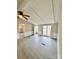 Bright and airy living room with a ceiling fan, large window, and new gray flooring at 1718 Fallston Rd, Shelby, NC 28150