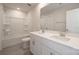 Bright bathroom features a shower-tub combo, double vanity, and ample counter space at 1735 Braemar Village Dr, Monroe, NC 28110