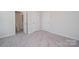 A cozy bedroom offers natural light and access to the ensuite bathroom at 1735 Braemar Village Dr, Monroe, NC 28110