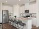 Bright kitchen featuring a large island, stainless appliances, and modern cabinets at 1735 Braemar Village Dr, Monroe, NC 28110
