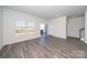 A bright living area features stylish flooring and access to the outdoor patio at 1735 Braemar Village Dr, Monroe, NC 28110