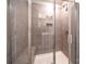 A stylish shower features tiled walls, a built-in seat, and glass doors at 1735 Braemar Village Dr, Monroe, NC 28110