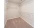 The walk-in closet provides ample storage space with wire shelving at 1735 Braemar Village Dr, Monroe, NC 28110