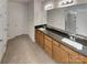Spacious bathroom with double vanity, granite countertops, and tiled floor at 1805 Palazzo Dr, Waxhaw, NC 28173