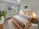 Brightly staged bedroom with a large window and neutral decor at 1805 Palazzo Dr, Waxhaw, NC 28173