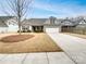 Charming single-story home featuring manicured lawn, neutral siding, and an attached two-car garage at 1805 Palazzo Dr, Waxhaw, NC 28173
