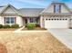 Charming home featuring neutral siding, manicured lawn, and a two-car garage at 1805 Palazzo Dr, Waxhaw, NC 28173